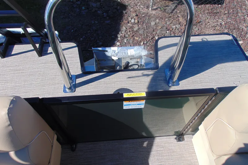 Slide: The Image of 2026 Godfrey Xperience 2086SBX boat deck with safety gate and stainless steel rails. - 12