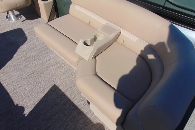 Slide: The Image of 2026 Godfrey Xperience 2086SBX boat seating with beige upholstery and built-in cup holders. - 5