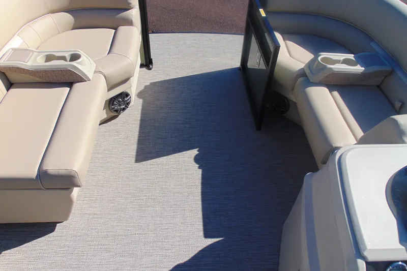 Slide: The Image of Interior of 2026 Godfrey Xperience 2086SBX pontoon boat with beige seating and cup holders. - 7