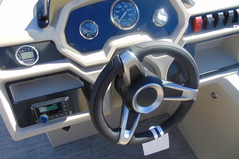 Slide: The Image of Steering console of 2026 Godfrey Xperience 2086SBX boat with modern controls and gauges. - 9
