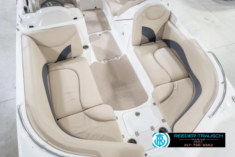 Slide: The Image of 2017 Hurricane SunDeck Sport 202 OB boat interior with beige seating and carpeted floor. - 13