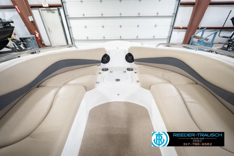 Slide: The Image of 2017 Hurricane SunDeck Sport 202 OB interior with beige seating and carpeted floor. - 18