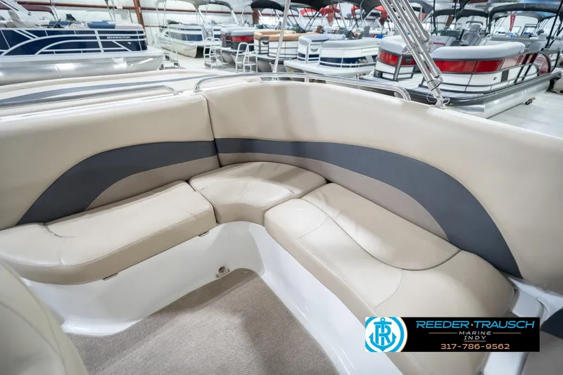 Slide: The Image of 2017 Hurricane SunDeck Sport 202 OB boat interior with beige seating in showroom. - 22