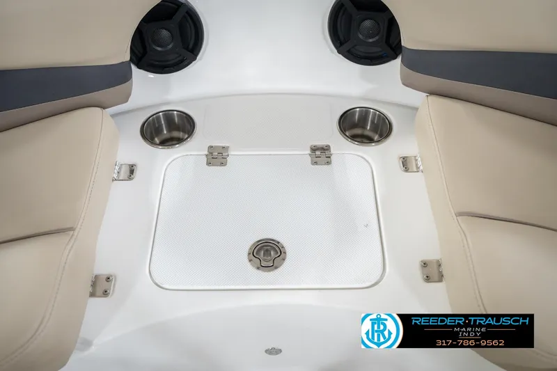 Slide: The Image of 2017 Hurricane SunDeck Sport 202 OB boat interior with cup holders and storage compartment. - 27