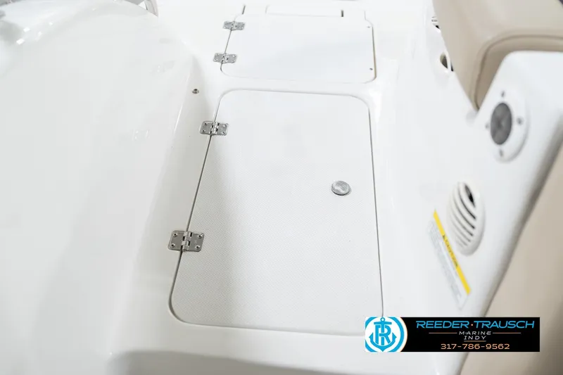 Slide: The Image of 2017 Hurricane SunDeck Sport 202 OB boat interior with storage compartment and seating. - 29