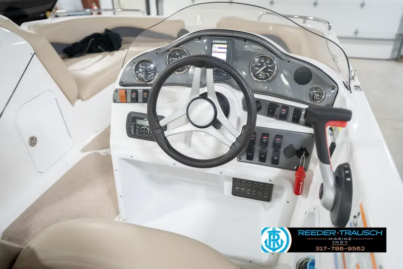 Slide: The Image of 2017 Hurricane SunDeck Sport 202 OB boat dashboard with steering wheel and control panel. - 31