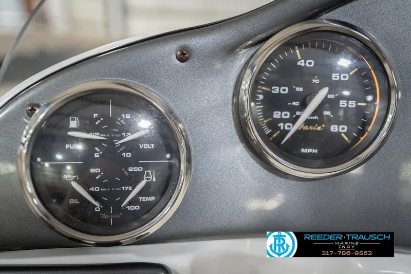Slide: The Image of Dashboard gauges of a 2017 Hurricane SunDeck Sport 202 OB boat, showing speed and fuel indicators. - 36