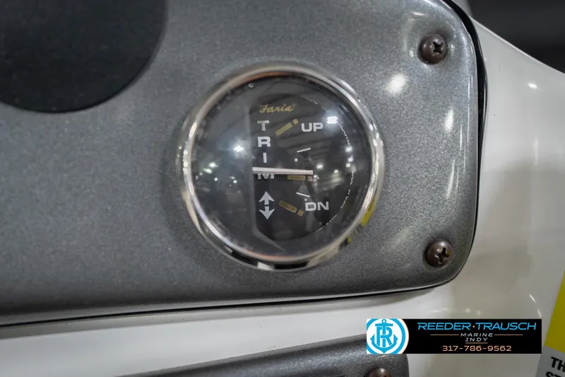 Slide: The Image of 2017 Hurricane SunDeck Sport 202 OB trim gauge close-up with Reeder-Trausch Marine logo. - 39