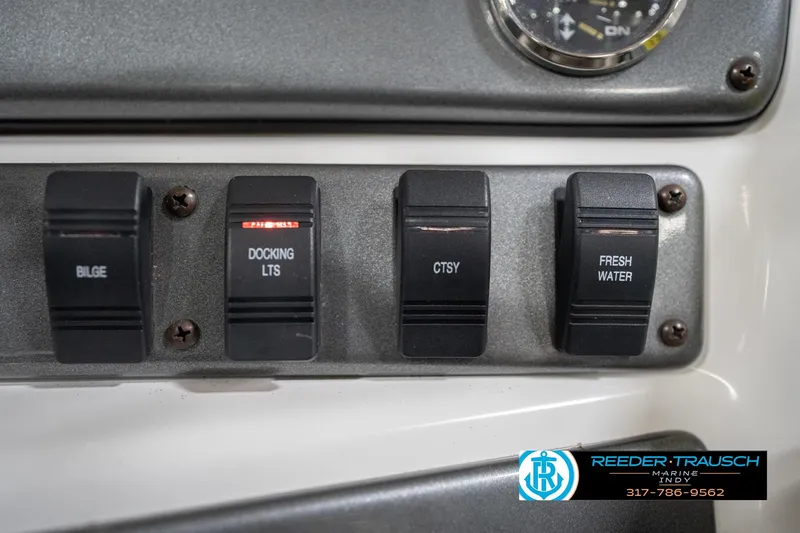 Slide: The Image of Control panel of 2017 Hurricane SunDeck Sport 202 OB boat with labeled switches. - 40