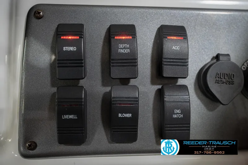 Slide: The Image of Control panel of a 2017 Hurricane SunDeck Sport 202 OB boat with labeled switches. - 41