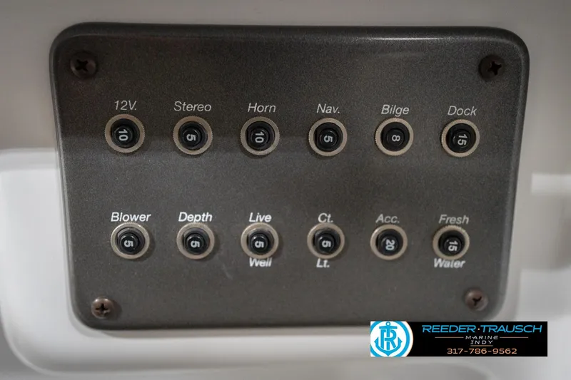 Slide: The Image of Control panel of a 2017 Hurricane SunDeck Sport 202 OB boat with labeled switches. - 42