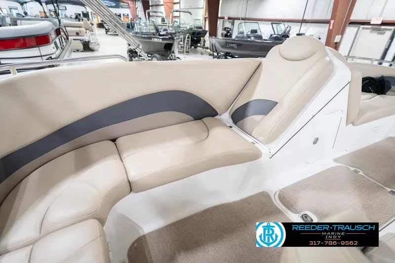 Slide: The Image of 2017 Hurricane SunDeck Sport 202 OB boat interior with beige seating and carpeted flooring. - 45