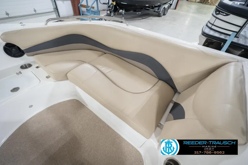 Slide: The Image of 2017 Hurricane SunDeck Sport 202 OB boat interior with beige seating and carpeted floor. - 46