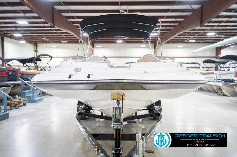 Slide: The Image of 2017 Hurricane SunDeck Sport 202 OB boat in showroom, front view with canopy. - 5