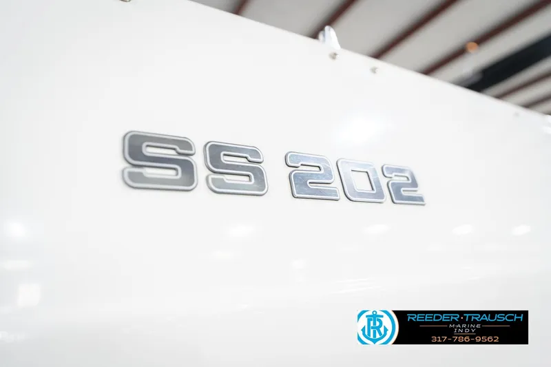 Slide: The Image of 2017 Hurricane SunDeck Sport 202 OB boat emblem with Reeder-Trausch Marine logo. - 56