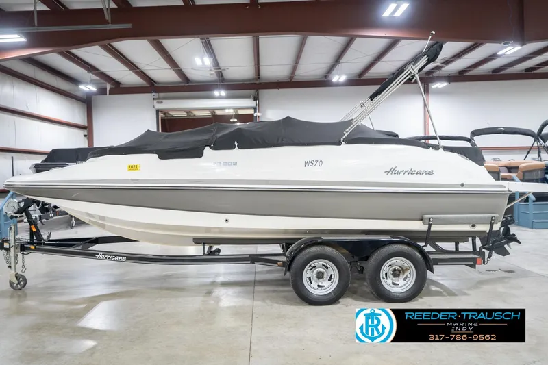 Slide: The Image of 2017 Hurricane SunDeck Sport 202 OB boat on trailer in indoor storage facility. - 59
