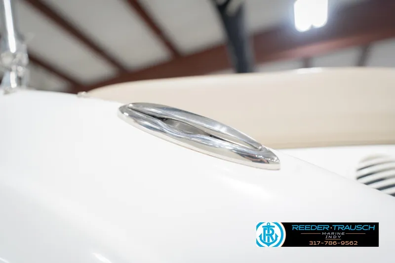 Slide: The Image of 2017 Hurricane SunDeck Sport 202 OB boat detail with chrome cleat in showroom. - 60