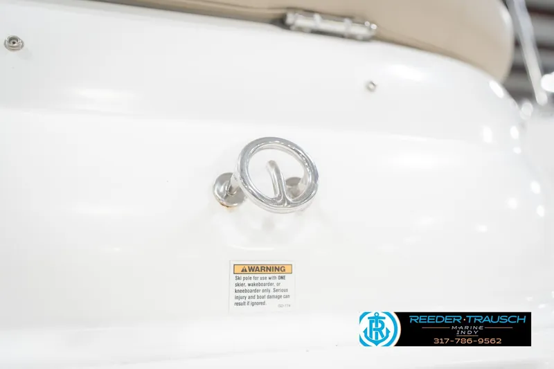 Slide: The Image of 2017 Hurricane SunDeck Sport 202 OB boat detail with warning label and metal fixture. - 62