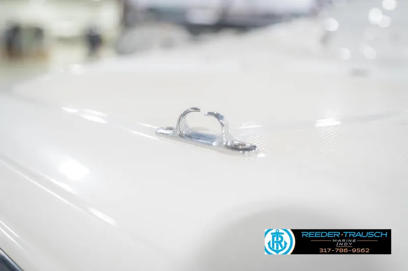 Slide: The Image of 2017 Hurricane SunDeck Sport 202 OB boat detail with chrome cleat, Reeder Trausch Marine logo. - 63