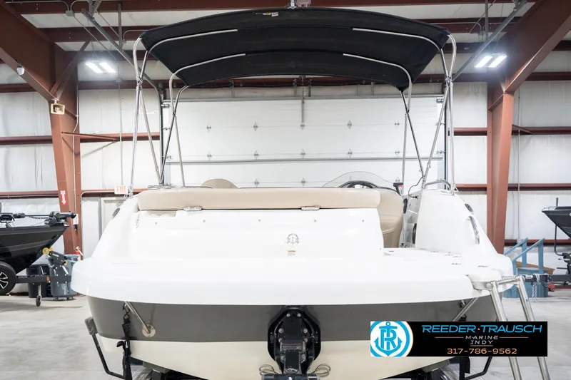 Slide: The Image of 2017 Hurricane SunDeck Sport 202 OB boat in indoor showroom. - 9
