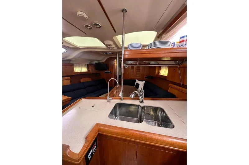 Slide: The Image of Interior of 2003 Hunter 386 yacht with modern kitchen and cozy seating area. - 21