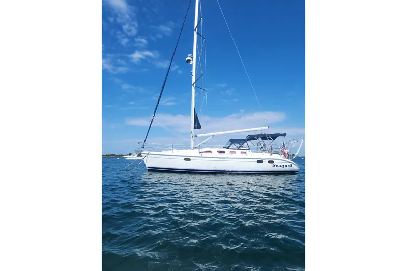 Slide: The Image of Sailboat "Seaquel" on water, 2003 Hunter 386 model, clear blue sky background. - 3