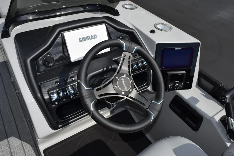 Slide: The Image of 2026 Bentley Pontoons Elite 223 Swingback dashboard with Simrad navigation system and steering wheel. - 11