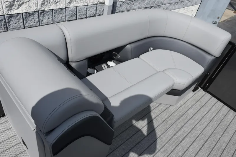 Slide: The Image of 2026 Bentley Pontoons Elite 223 Swingback with luxurious gray seating and cup holders. - 14