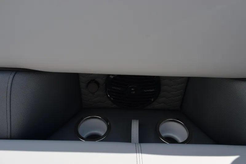 Slide: The Image of 2026 Bentley Pontoons Elite 223 Swingback interior with cup holders and speaker. - 16