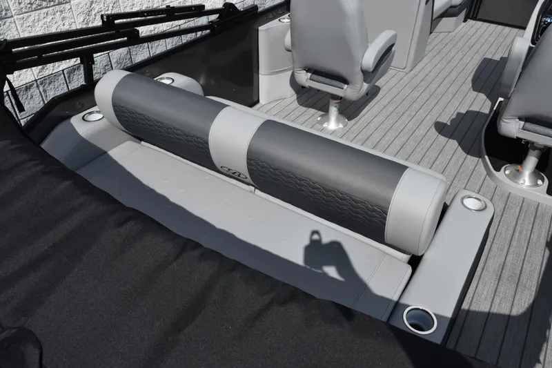 Slide: The Image of 2026 Bentley Pontoons Elite 223 Swingback interior with gray seating and cup holders. - 8