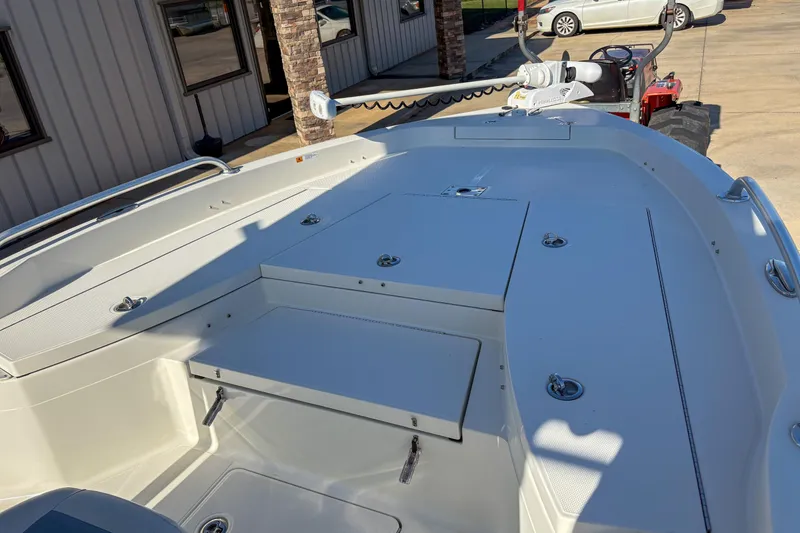 Slide: The Image of 2019 Ranger 2510 Bay boat deck with storage compartments and trolling motor. - 11