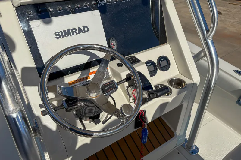 Slide: The Image of 2019 Ranger 2510 Bay boat console with Simrad display and steering wheel. - 9