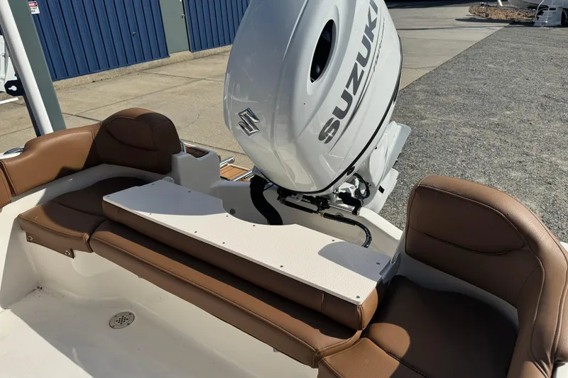 Slide: The Image of 2026 Pioneer 202 Islander boat with Suzuki outboard motor and brown seating. - 3