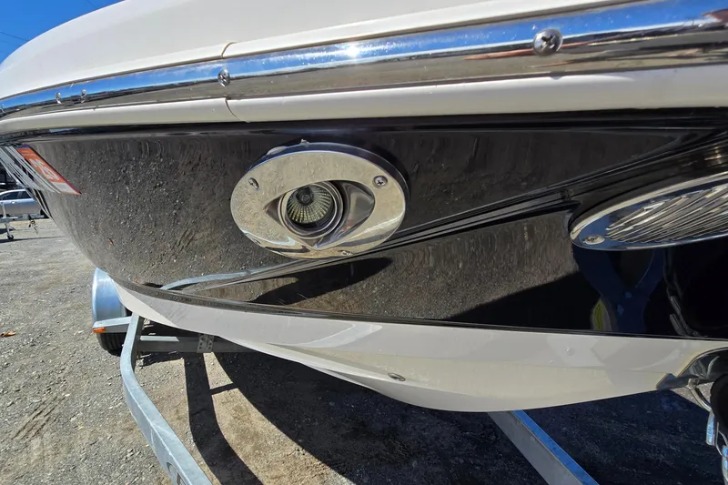 Slide: The Image of 2012 Chaparral 196 SSi boat close-up, showcasing sleek chrome detailing. - 11