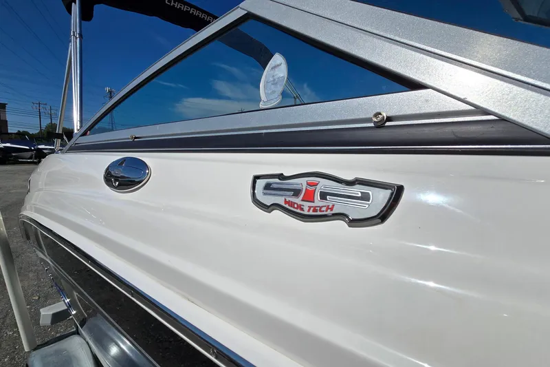 Slide: The Image of 2012 Chaparral 196 SSi boat with Wide Tech badge, side view. - 12