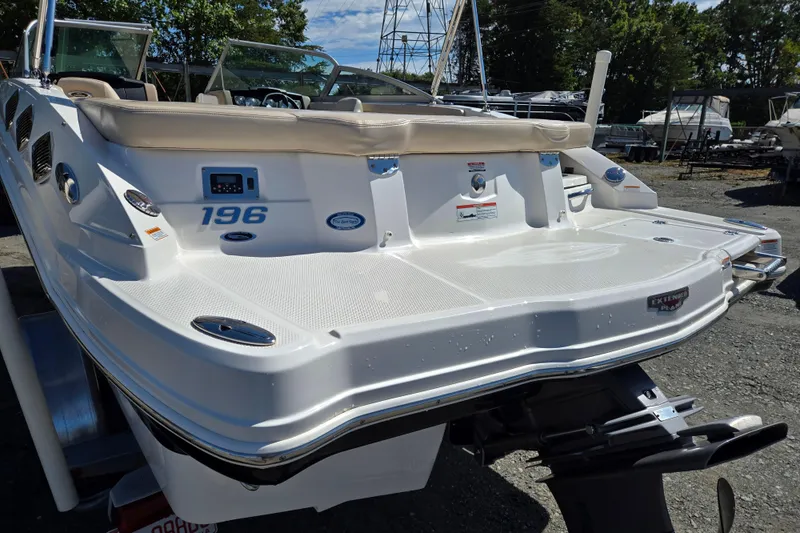 Slide: The Image of 2012 Chaparral 196 SSi boat, rear view, showcasing swim platform and seating. - 15