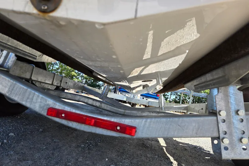 Slide: The Image of Underneath view of a 2012 Chaparral 196 SSi boat on a trailer. - 19