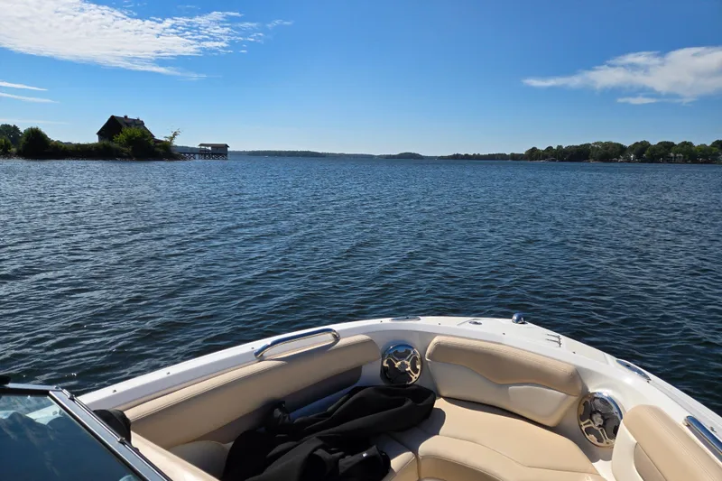 Slide: The Image of Chaparral 196 SSi boat on a serene lake, clear blue sky, 2012 model. - 22