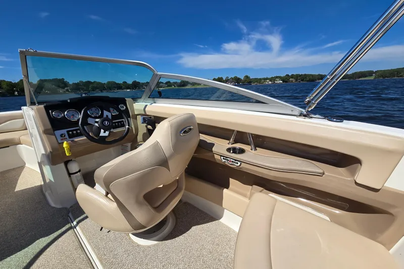 Slide: The Image of Interior view of 2012 Chaparral 196 SSi boat with steering wheel and dashboard. - 24