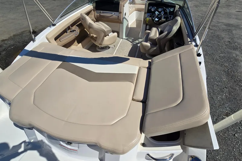 Slide: The Image of 2012 Chaparral 196 SSi boat interior with beige seating and steering console. - 29