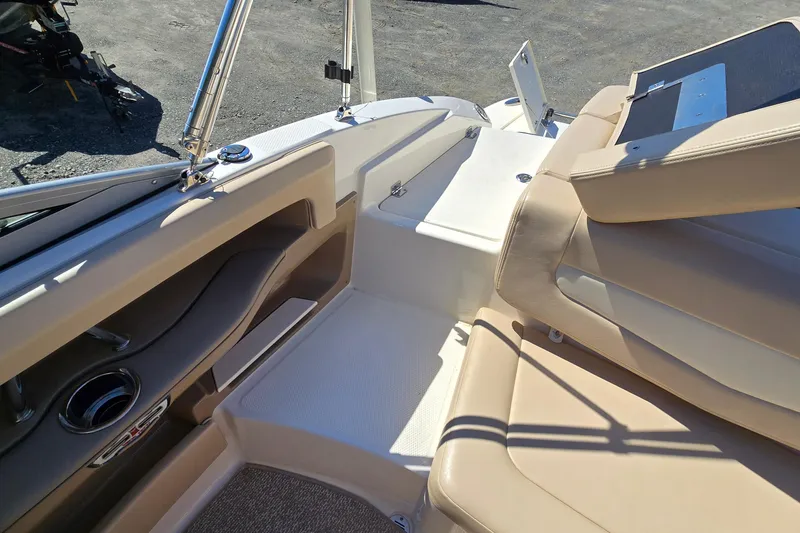 Slide: The Image of Interior of a 2012 Chaparral 196 SSi boat with beige seating and sleek design. - 33