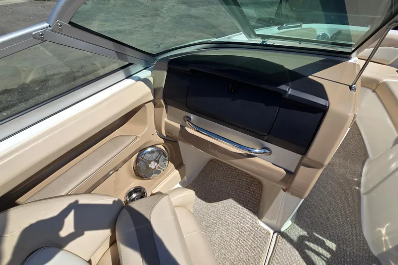 Slide: The Image of Interior of 2012 Chaparral 196 SSi boat with beige seating and speaker. - 34