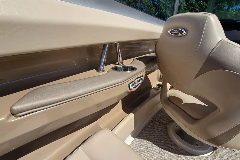 Slide: The Image of Interior of 2012 Chaparral 196 SSi boat with beige seating and cup holder. - 35