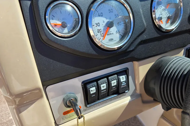 Slide: The Image of Dashboard of a 2012 Chaparral 196 SSi boat with gauges and controls. - 38
