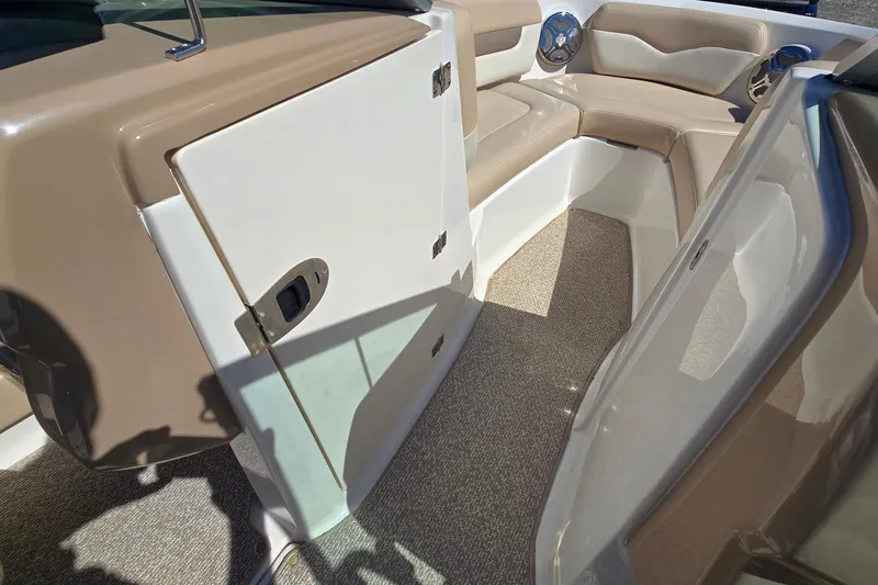 Slide: The Image of Interior view of 2012 Chaparral 196 SSi boat with beige seating and carpeted flooring. - 41
