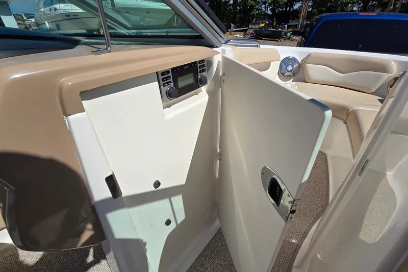 Slide: The Image of 2012 Chaparral 196 SSi boat interior with open storage compartment and seating area. - 43