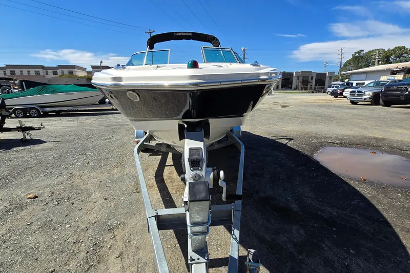 Slide: The Image of Chaparral 196 SSi 2012 boat on trailer in outdoor lot under clear blue sky. - 5