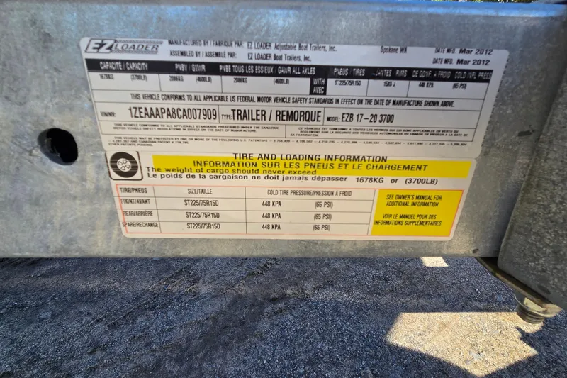 Slide: The Image of Label on a 2012 Chaparral 196 SSi trailer showing tire and loading information. - 57