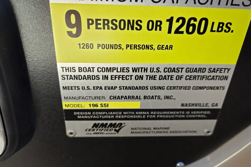 Slide: The Image of 2012 Chaparral 196 SSi capacity label, 9 persons or 1260 lbs, safety compliance. - 60