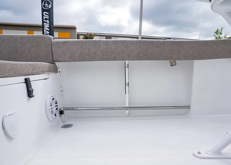 Slide: The Image of Interior view of 2026 Sea Hunt Ultra 229 boat, featuring seating and speaker. - 10